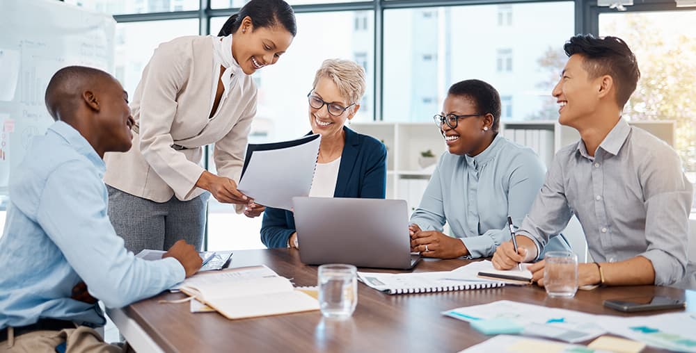 Real estate professionals meeting to plan a property purchase